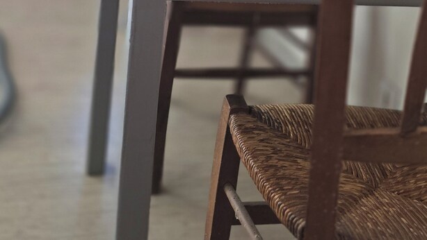 A dining table with chairs, a cabinet, and a mirror. - Village house (Castifao)
