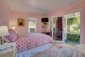 A bedroom with a bed, a desk, a television, and a window. - Beautiful 9-bedroom bed & breakfast in pleasant Santa Barbara (Santa Barbara)