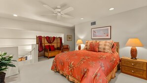 A bedroom with a bed, bedside tables, a ceiling fan, and a framed picture on the wall. - Beachfront 4BR, 2 Condos for 12 at Maalaea Surf! (Kihei)