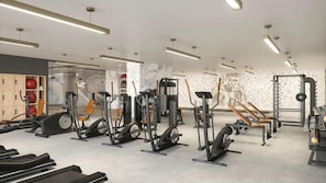 A modern gym with various exercise equipment, including treadmills, stationary bikes, and weight machines. - Downtown Miami and near Kaseya Center, DeluxeBR (Miami)