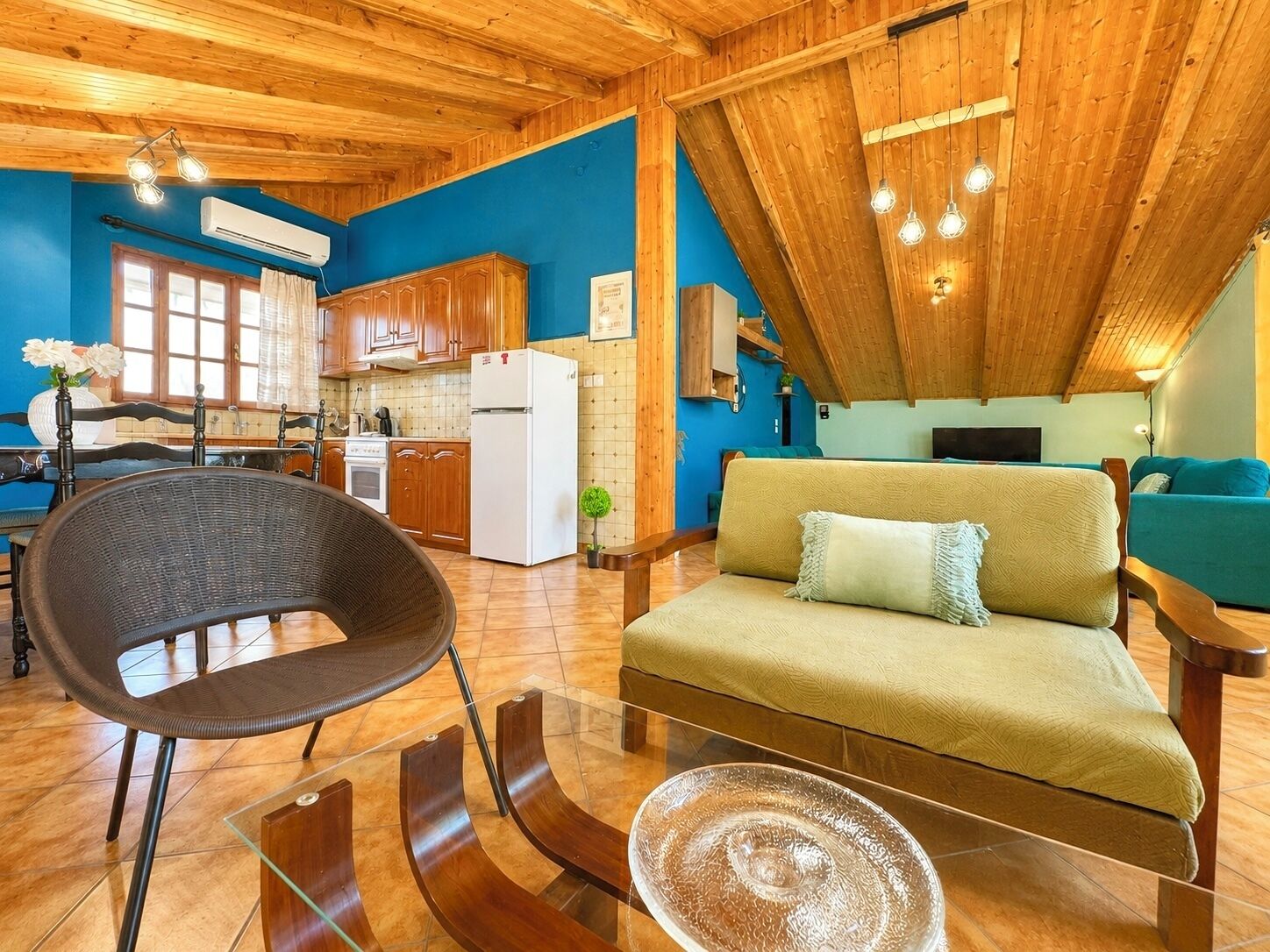 A cozy interior with a dining area, kitchen, and living space.