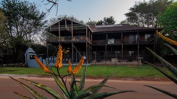A two-story building with a balcony on the upper level.