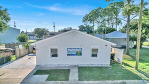 A small, single-story building with a sign that reads "SEASIDE Escape."