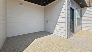 A covered outdoor area with a concrete floor, a door, and a window. - Mountain Escape - Minutes to Snowbasin & Pineview - Sleeps 8 (Mountain Green)
