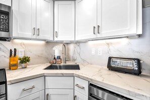 Featuring new appliances, the fully equipped kitchen is the perfect place to whip up an island meal  - Valley Isle Villas | Oceanfront Studio | Car Incl. w/ 6+ Nights | VIR-107 by KBM (Lahaina)
