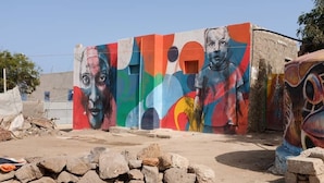 A colorful mural on a building's exterior wall.