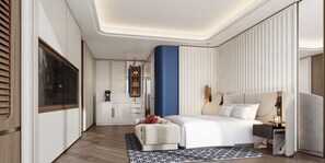 Une chambre d’hôtel moderne dotée d’un grand lit, d’un coin salon et d’une kitchenette.