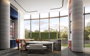 A modern interior with a marble countertop, a seating area, and large windows offering a view of a hedge and sky. - FILA HOUSE SHANGHAI, A JDV BY HYATT HOTEL (Shanghai)