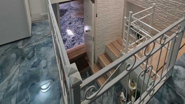 A staircase with a white railing, a white wall with a textured pattern, and a small window with a frosted glass panel. - Furnished and fully equipped Piazza Plebiscito House on Via Toledo in downtown Naples (Napoli)