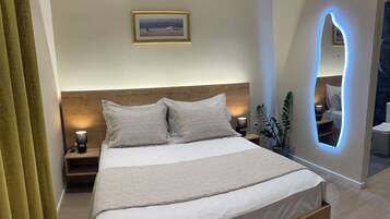 Premium bedding, memory-foam beds, minibar, laptop workspace