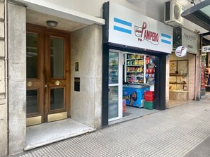 A storefront with a sign that reads 'Super Pampo' and a display of various packaged goods. - 157- Apt. with Great Location for 3 p. in Recoleta (Buenos Aires)