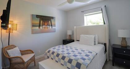 Renovated Coastal Hideaway • 2BR • Minutes to Beach • Private Parking & 65” TV