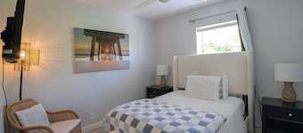 Renovated Coastal Hideaway • 2BR • Minutes to Beach • Private Parking & 65” TV
