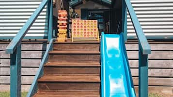A wooden staircase leading to a building with a sign reading 'PORT CAMPBELL'.