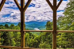A wooden structure with a view of a river and mountains. - Timber Ridge Reserve-new 4 bed/4 ba home- stunning Smoky Mountain & lake views (Bryson City)
