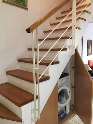 A staircase with wooden steps and white railings. - Sea View Paradise Retreat in Nikiti (Nikiti)