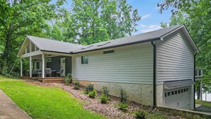 A single-story house with a covered porch and a garage.