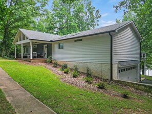 A single-story house with a covered porch and a garage.