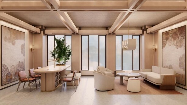 Un interior moderno con una mesa de comedor redonda, sofás y una planta en maceta.