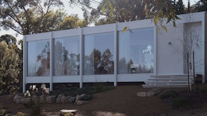 A modern building with large glass windows, a flat roof, and a minimalist design. - PerCapita Home Daylesford (Daylesford)