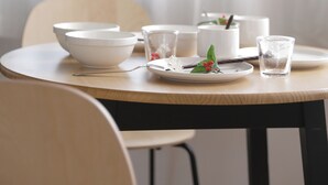 A dining table with white plates, bowls, and glasses, set against a backdrop of sheer curtains. - Neo Universal 01 (Osaka, Konohana, Nishikujo)