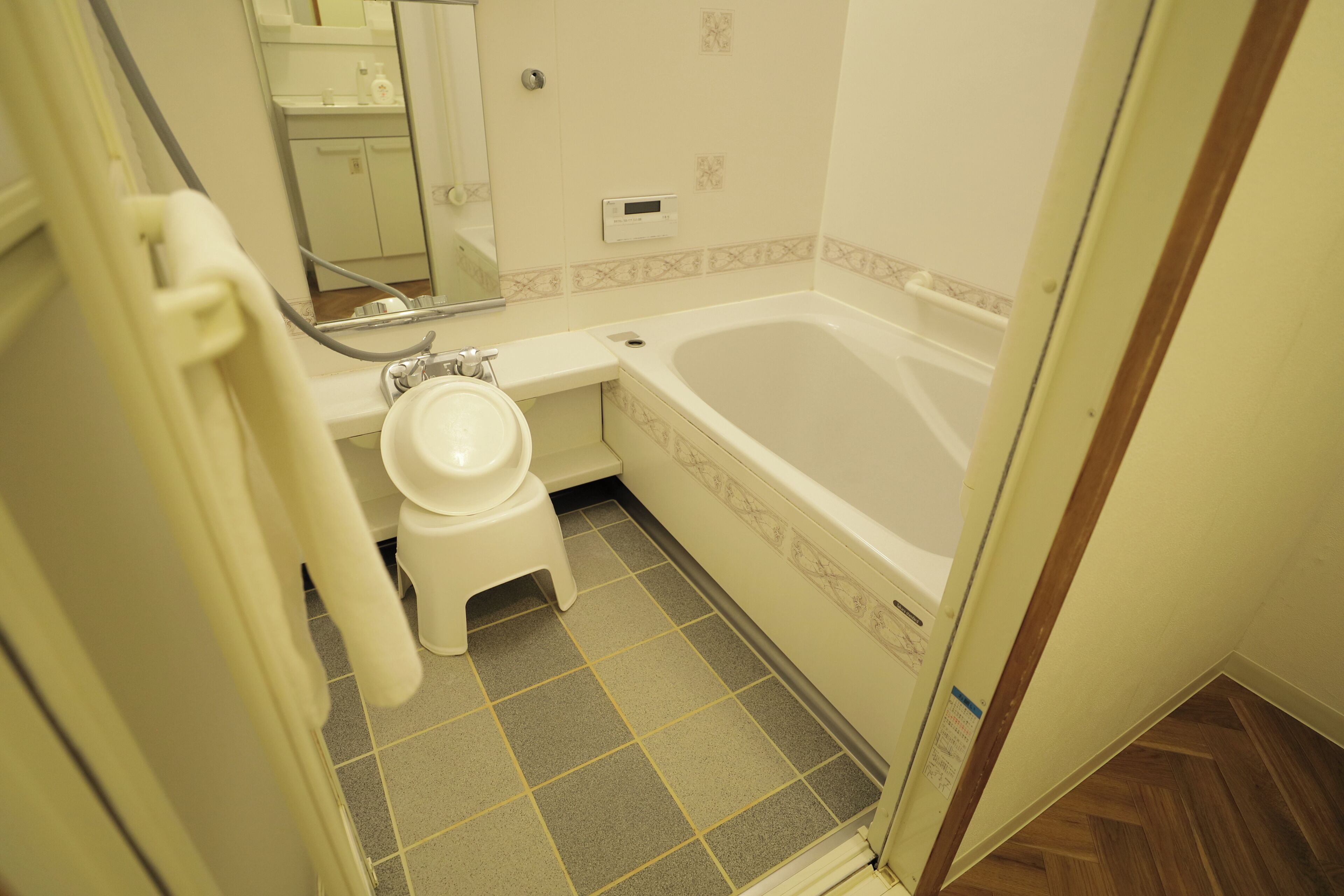 A bathroom with a toilet, a sink, and a bathtub.