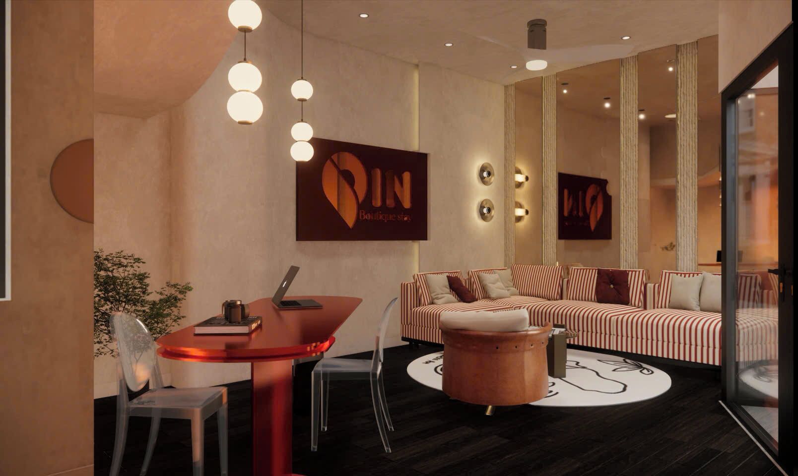 Un intérieur moderne avec un canapé, une table ronde et des luminaires suspendus.