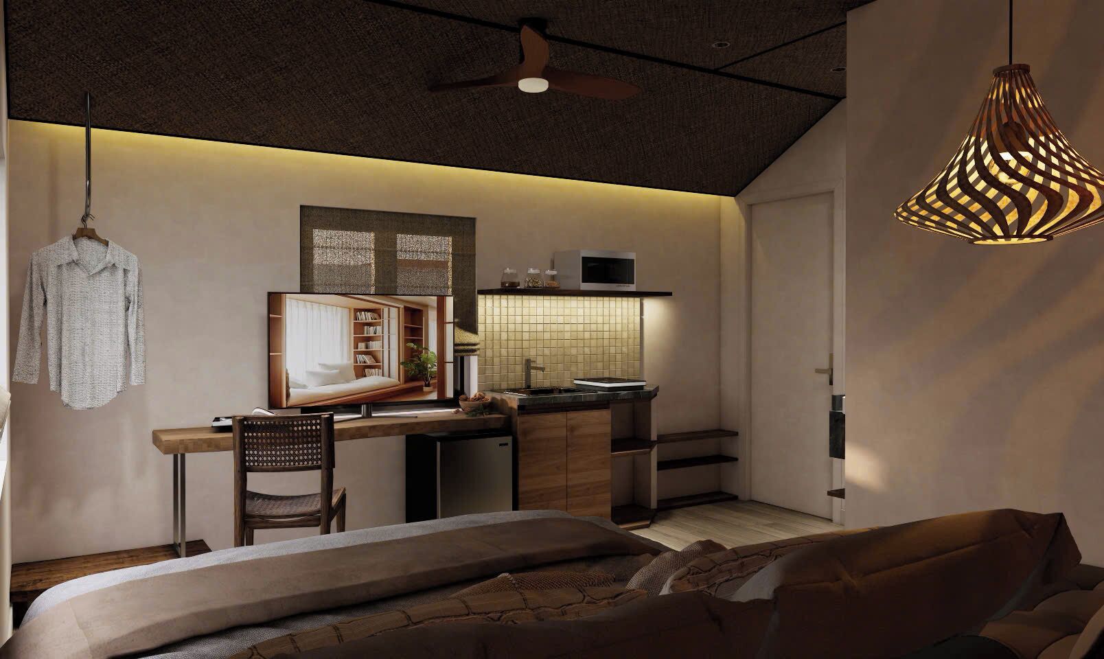 A compact bedroom with a bed, a desk, and a kitchenette.