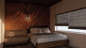 A bedroom with a bed, a sofa, a window with blinds, and a hanging light fixture. - PIN GEM Boutique (Ho Chi Minh City)
