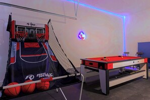 A recreational room with a basketball hoop, a pool table, and LED lighting. - Spacious 4-bedroom house in Houston Texas Hot tub/ Play room. (Houston)
