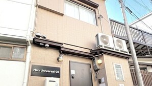 A building with a sign reading 'Neo Universal 02,' a door, and an air conditioning unit. - Neo Universal 02 (Osaka, Konohana Ward, Nishikujo)