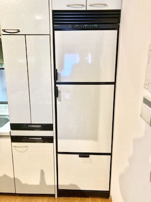 A kitchen with a white refrigerator and a white oven. - Neo Universal 04 (Osaka, Konohana, Nishikujo)