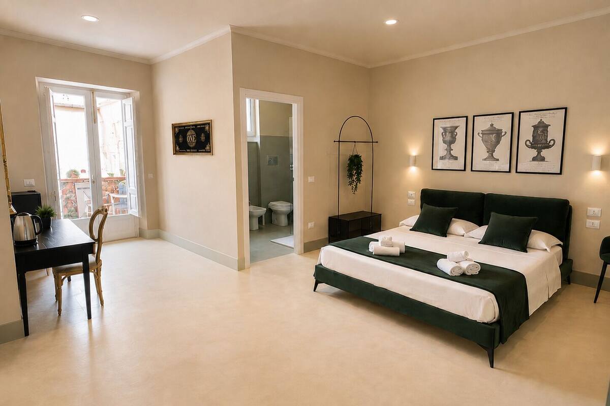 Deluxe Quadruple Room | In-room safe, desk, laptop workspace, blackout curtains