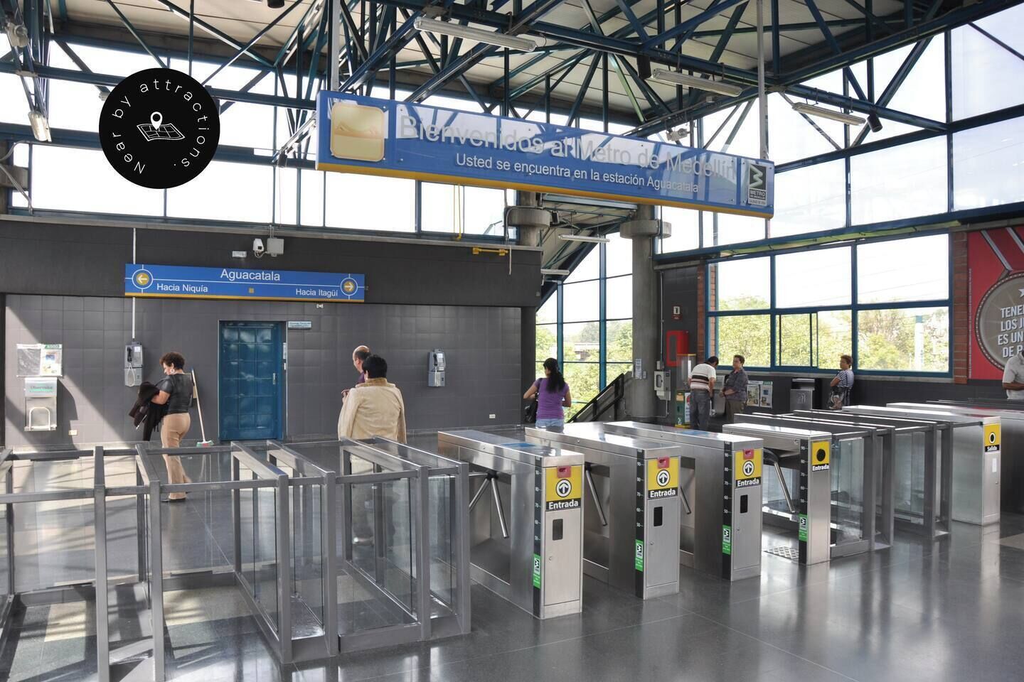 A metro station with clear signage, ticket barriers, and a modern architectural design.