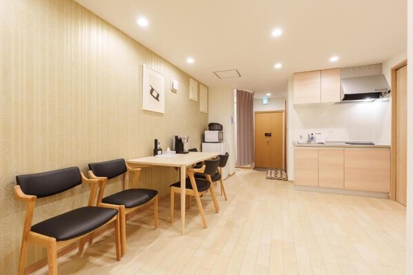 A modern kitchen with a dining area.