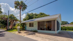 A single-story house with a porch, a mailbox, and a small garden area. - Flip-Flop to Beach & Flagler Ave! Breezy Getaway (New Smyrna Beach)