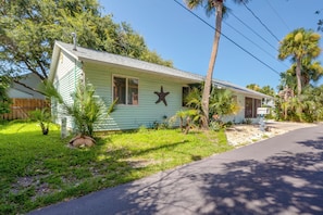 A single-story house with a front porch, a mailbox, and a star decoration on the wall. - Freshly Updated, Flip-Flop 2 blocks to Beach! (New Smyrna Beach)