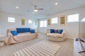 A spacious room with two sofas, a ceiling fan, and artwork on the walls. - Fenced Yard! Family Getaway, Near Texas Ski Ranch (San Marcos)