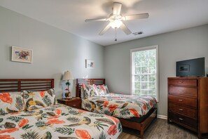 A bedroom with two beds, a ceiling fan, a dresser, and a window with blinds. - Walk to Beach! Murrells Inlet Sanctuary w/ Hot Tub (Murrells Inlet)