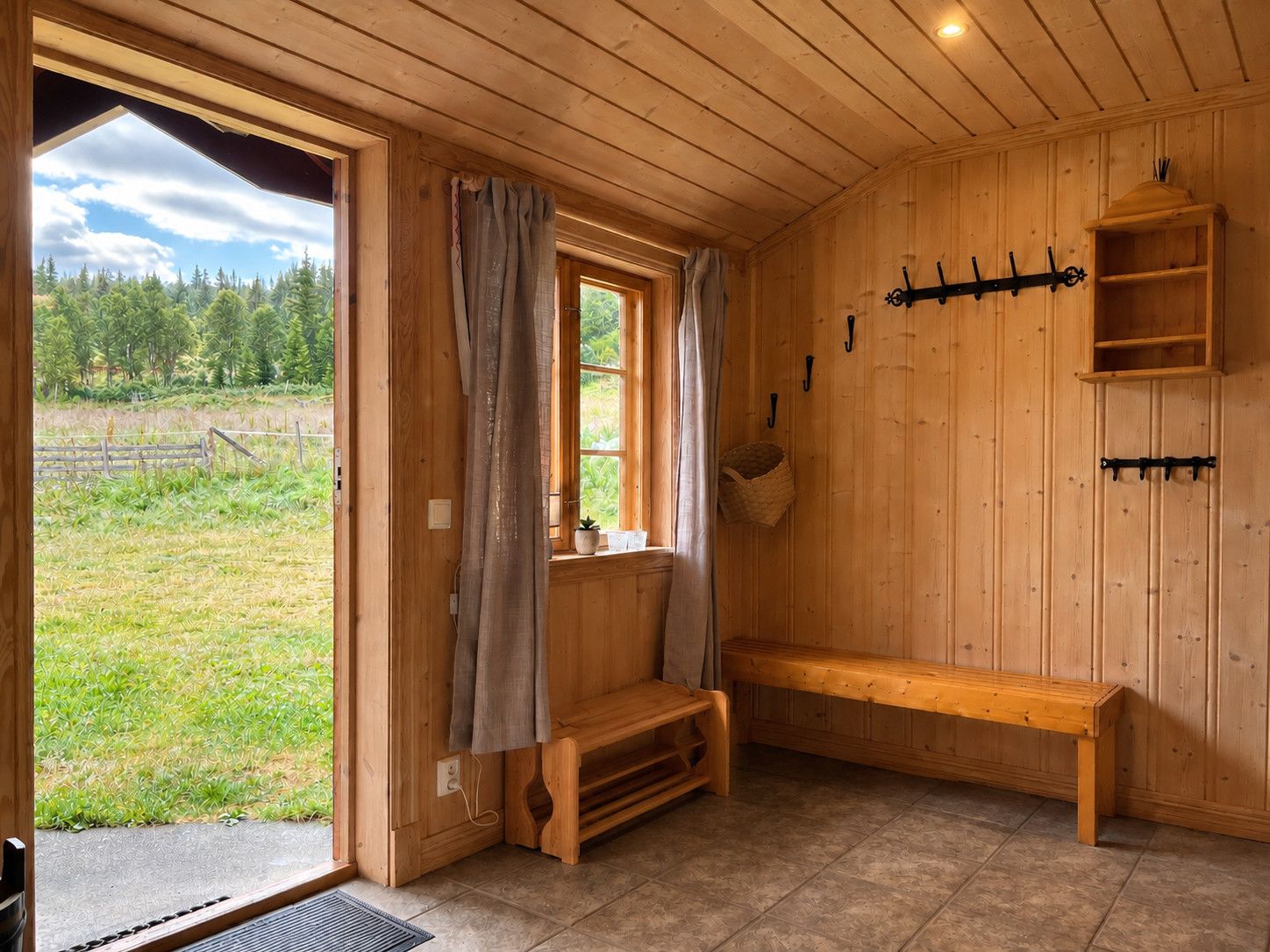 A wooden interior with a bench, a window with curtains, and a wall-mounted rack.