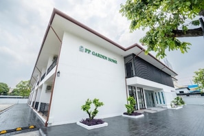 A modern building with a sign reading 'PP Garden Home.' - PP Garden Home (Bangkok)