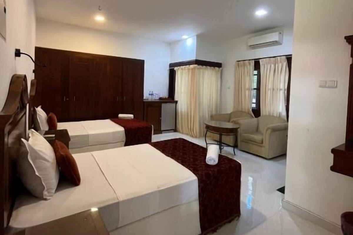 Deluxe Twin Room, Patio, Pool View | In-room safe, free WiFi