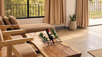 A modern living room with a sofa, wooden coffee table, and a balcony view.