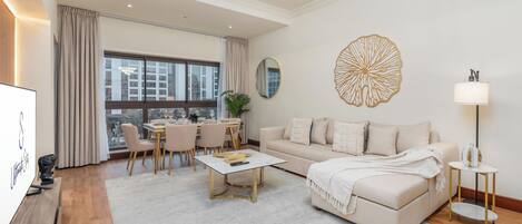 Superior Apartment, Balcony, City View | Living area | 55-inch flat-screen TV with digital channels