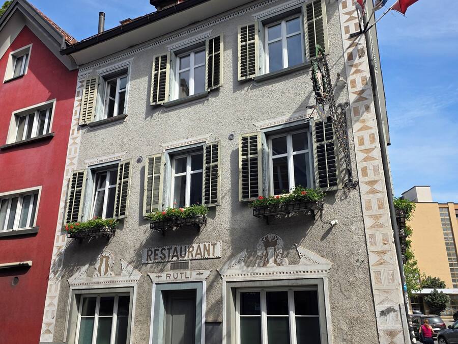 A two-story building with a sign indicating it's a restaurant.