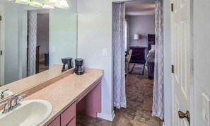 A bathroom with a sink, mirror, and coffee maker. - Shad Room - Cozy Private Bedroom in a Shared Home (Sebring)