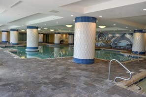 An indoor swimming pool with tiled columns and a mural in the background. - 10% off 3-7 nights thru Dec. Ocean Drive. Oceanfront with OCEAN VIEW (from side). (North Myrtle Beach)