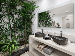 A modern bathroom with a large mirror, two vessel sinks, and a variety of plants. - Private Tropical Hideaway in Seminyak (Seminyak)