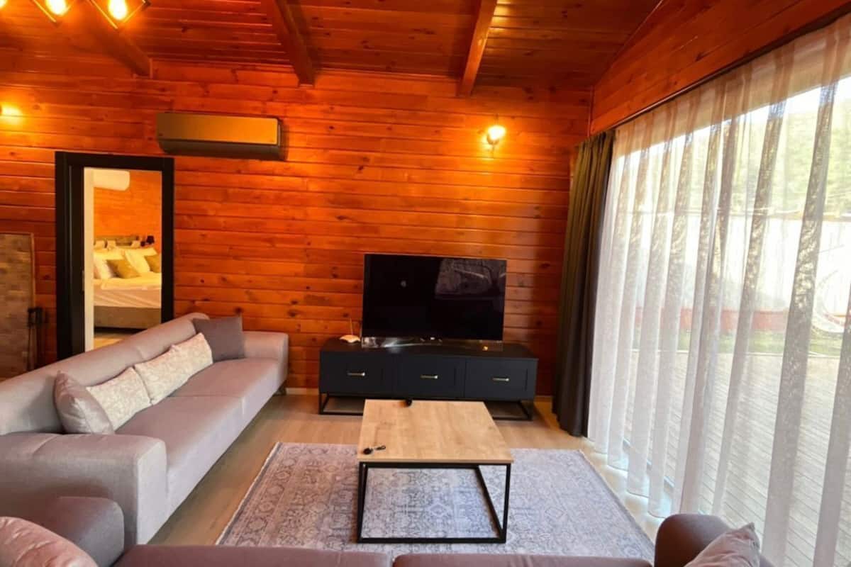 Bungalow Luxe, piscine privée, vue piscine | Coin séjour