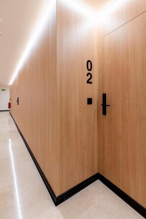 A wooden door with a number '02' indicating a room or section. - VORS&Co Jerez (Jerez de la Frontera)